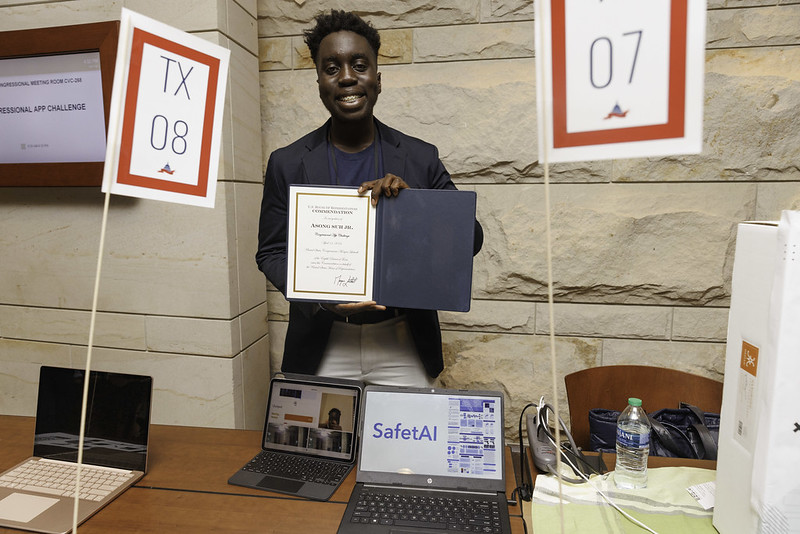 An App Challenge winner shows off his certificate