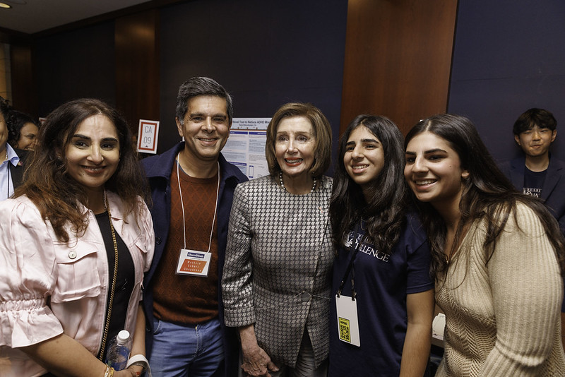 Speaker Emerita Pelosi poses for a photo with her winner